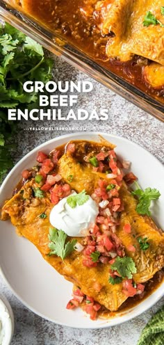 an enchiladas dish with sour cream and cilantro on the side