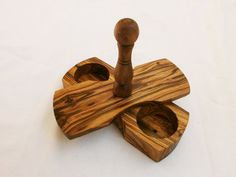 a wooden toy with three pieces of wood in it