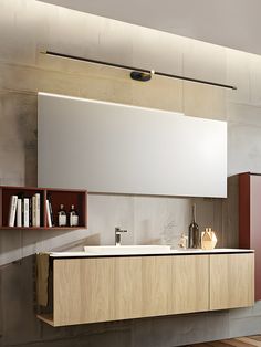 a bathroom with a sink, mirror and shelving unit on the wall in front of it