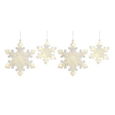 three snowflakes hanging from the ceiling