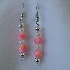 two pairs of pink and white beaded earrings