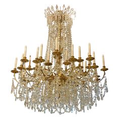 a large chandelier with many candles hanging from it