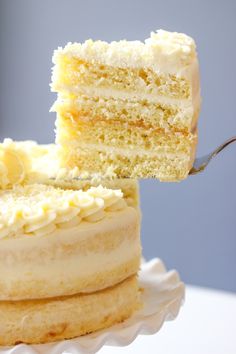 a piece of cake is being cut with a fork