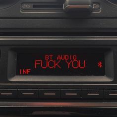 an old car radio with the words bt and i f k you written on it