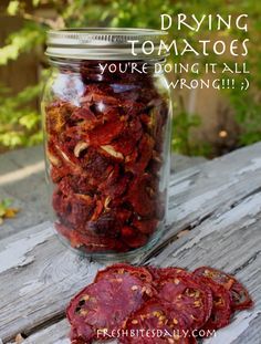 dried tomatoes in a mason jar with text overlay saying drying tomatoes you're doing it all wrong