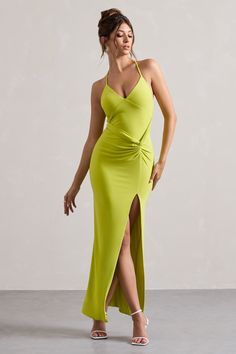 Dare to dream in Domenica, our latest statement maxi dress. Arriving in a bold lime green shade of our signature jersey that's effortlessly flattering. Domenica boasts a halter neckline, a flattering cowl racerback and a knotted wrap skirt for an ultra sculpting fit. Keep this maxi at the forefront with a sleek bun and some gold accents.Features - Premium stretch jersey- Halter neckline- Cowl racerback- Sleeveless - Invisible zip closure- Knotted wrap skirt - Thigh split- Maxi length Sizing & Fit Model is 5'7 and wears AU size 8 / US size 4Product Information Designed exclusively by Club L London Fully lined with no stretch Premium jersey in Lime (95% Polyester, 5% Elastane) 155cm total length SKU: CL134084009 Midi Bridesmaid Dress, Club L London, Sleek Bun, Dare To Dream, Pastel Dress, Black Dress Prom, Elegant Outfits, Black Tie Gala, Wrap Maxi Dress