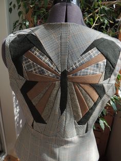 the back of a woman's dress made out of fabric