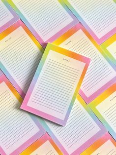 rainbow lined notepads on top of each other