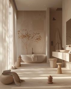 a bathroom with a large tub, sink and toilet next to a tree in the window