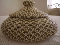 a woven basket sitting on top of a table