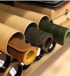 several rolls of leather on display in a store