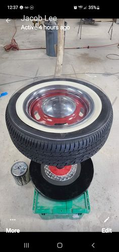 an old tire is being worked on by someone using a machine to make it look new