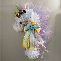 a unicorn head made out of mesh and ribbons