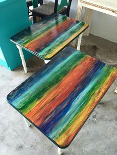 two multicolored tables sitting next to each other