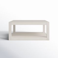 a white coffee table sitting on top of a white floor