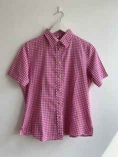 BUY 2 ITEMS GET 15% off at checkout   BUY 3 ITEMS GET 25% off at checkout  This is a lovely check print summer short sleeve button up shirt made of 100% cotton fabric in fuchsia pink color and white. This relaxed fit shirt is super comfortable and breathable, perfect for the summer.  Era: 90s Condition: great condition no visible signs of wear Size: D/NL 40, GB 14, F42, I 46 marked, fits like size M Measurements: Shoulder to shoulder: 15" / 38 cm Bust: 40.9" / 104 cm Waist: 35.4" / 92 cm Length: Cheap Gingham Shirt With Buttons, Shirts Button Up, Gingham Short Sleeve Top With Button Closure, Short Sleeve Gingham Tops With Button Closure, Gingham Summer Tops With Buttons, Summer Gingham Top With Button Closure, Summer Gingham Top With Buttons, Gingham Short Sleeve Shirt With Button Closure, Short Sleeve Gingham Shirt With Button Closure