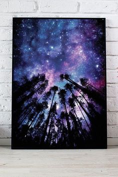 the night sky is filled with stars and trees