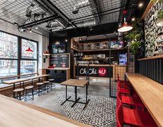 the inside of a restaurant with tables and chairs