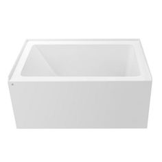 a white bath tub sitting on top of a white floor