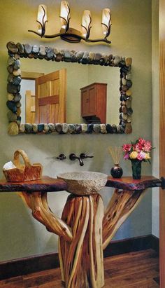 a bathroom with a tree stump sink and mirror