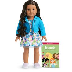 an american girl doll and book on a white background