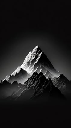 a black and white photo of a mountain with snow on it's summits