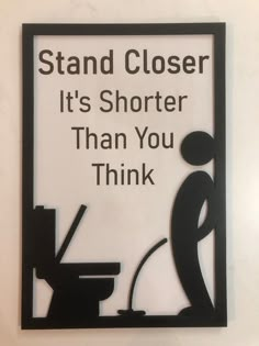 a sign that says stand closer it's shorter than you think on the wall