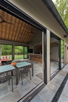 an outdoor living area with patio furniture and sliding glass doors