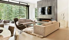 modern living room with fireplace and large windows