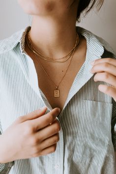 Add a personal touch to any look with The Not-So-Basic Letter Necklace. Customizable in your choice of length, this chic initial necklace is perfect for layering or wearing solo. Simple, stylish, and uniquely yours! ∙ D E T A I L S ∙- 18k Gold Filled Box Chain- 0.9mm Dainty Box Chain - Your choice of 16, 18, or 20 inches in length - Hypoallergenic (lead + nickel free) & Tarnish + Water Resistant ∙ G O L D ∙ F I L L E D ∙ Elevate your style with our gold-filled jewelry! Featuring over 100 times m Classic Initial Pendant Chain Necklace, Minimalist Initial Necklace With Paperclip Chain, Minimalist Initial Necklace With Paperclip Chain As Gift, Figaro Chain Initial Pendant Charm Necklace As Gift, Classic Everyday Tan Necklace, Classic Tan Necklace For Everyday, Classic Tan Initial Necklace For Everyday, Classic Tan Initial Necklace For Everyday Wear, Classic Rectangular Initial Necklace