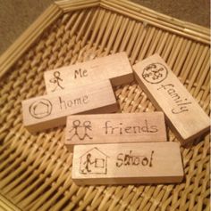 four wooden blocks with words on them that say home, friends and i am not