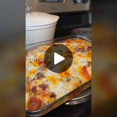 a casserole dish sitting on top of a stove in front of an oven