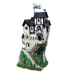 a lego model of a house on top of a hill