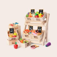 three wooden crates filled with fruits and vegetables