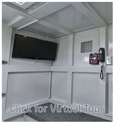 the interior of a mobile home with a flat screen tv mounted to it's wall