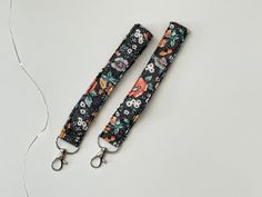 two lanyards that are sitting on a table