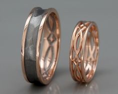 two wedding bands made out of gold and silver with an intricate design on the inside