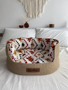 a dog bed made out of jute and fabric