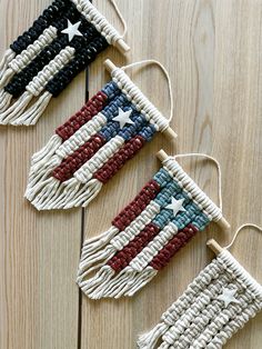 three american flags made out of woven string on wooden floor with one hanging from the ceiling