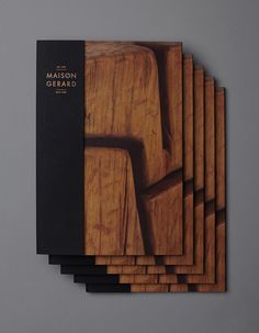 six wooden coasters stacked on top of each other with the words maison gerard printed on them