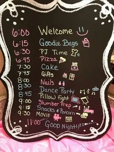 a chalkboard sign with some writing on it that says, welcome u goodie bags