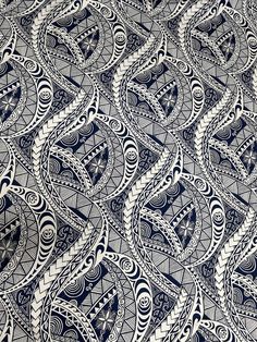 an intricate blue and white pattern on fabric