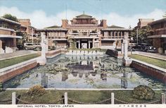 an old photo of a building with a pond in front