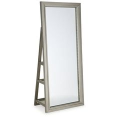 a large mirror sitting on top of a wooden stand