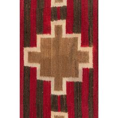 a red and brown rug with a cross on it