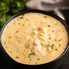 a close up of a bowl of food with broccoli in the back ground