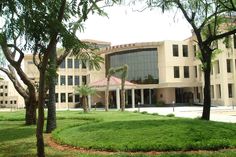 a large building with trees in front of it