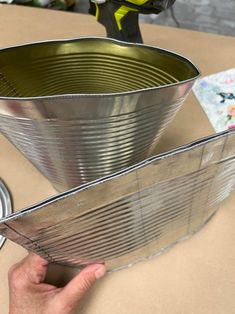 DIY Hanging Tin Can Craft - The Shabby Tree Smashed Can Wreath, Tin Can Wreath, Gallon Tin Can Crafts, Tin Coffee Can Ideas, Diy Tin Can Planter, Crafts Made From Tin Cans, Hanging Tin Can Planters, Tin Lids Crafts, Decoupage Smashed Tin Cans With Napkins