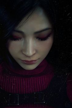 a close up of a person wearing a red sweater and black pants with her eyes closed