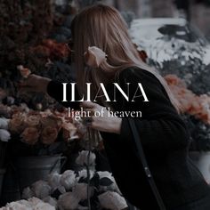 a woman standing in front of flowers with the words illana light of heaven